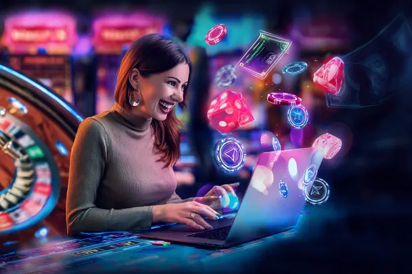 A woman smiling while playing online games on her laptop, surrounded by neon casino elements, showcasing GRAPWIN’s diverse game collection.